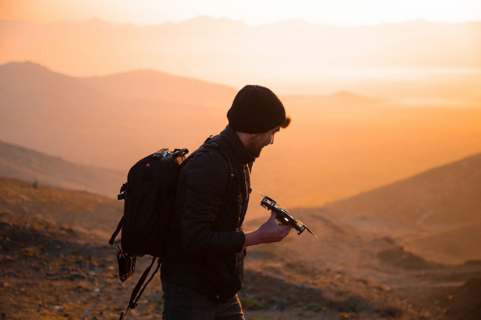 Person using a handheld communications device outdoors